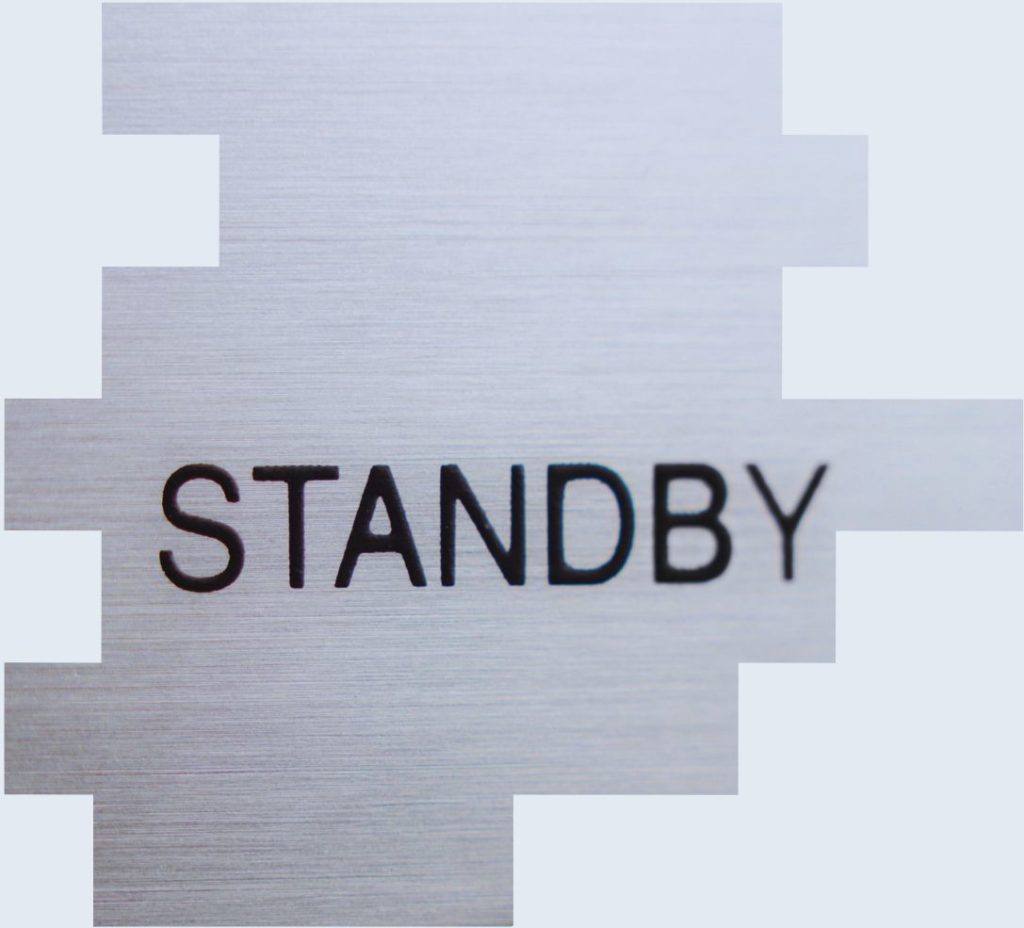 A picture of a sign with standby written on it to represent how employers should consider on-call and the Working Time Directive to remain compliant with UK law