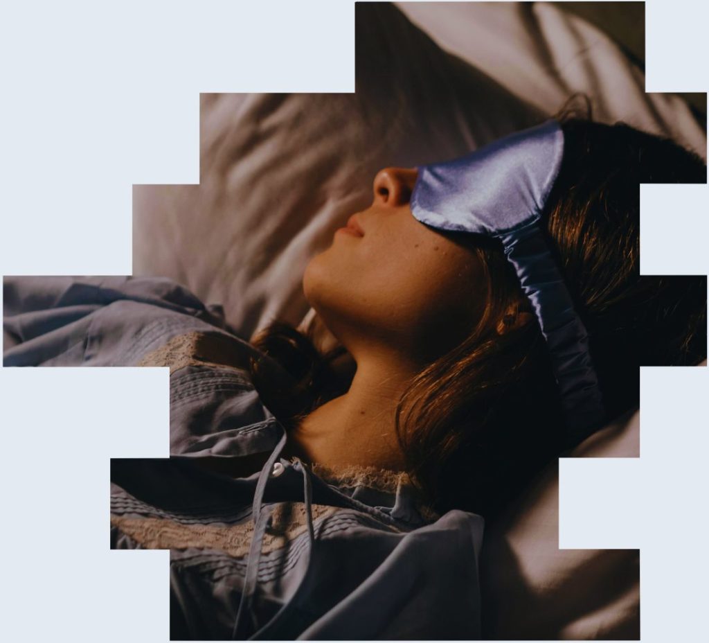 A picture of a woman shift worker asleep in the daytime using an eye mask to illustrate the importance of rest breaks for night shift workers