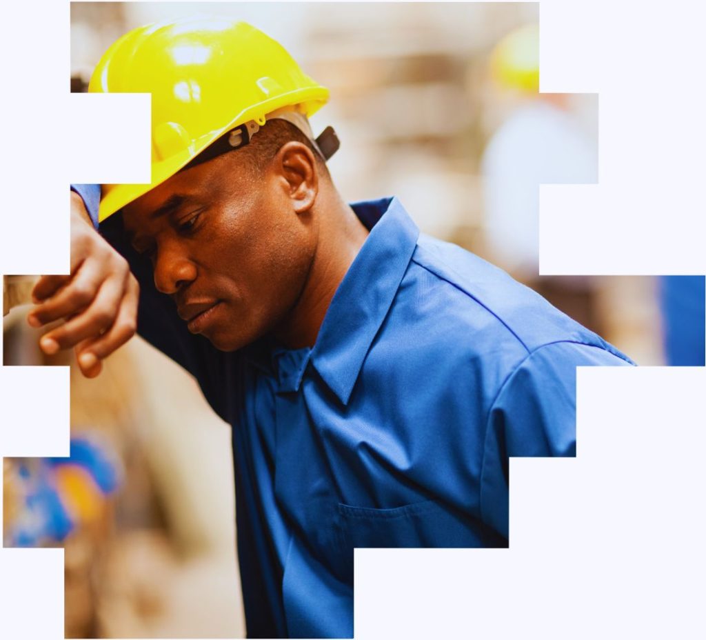 An image of a man in a hard hat that appears to be unwell to illustrate that the health effects of night shift work
