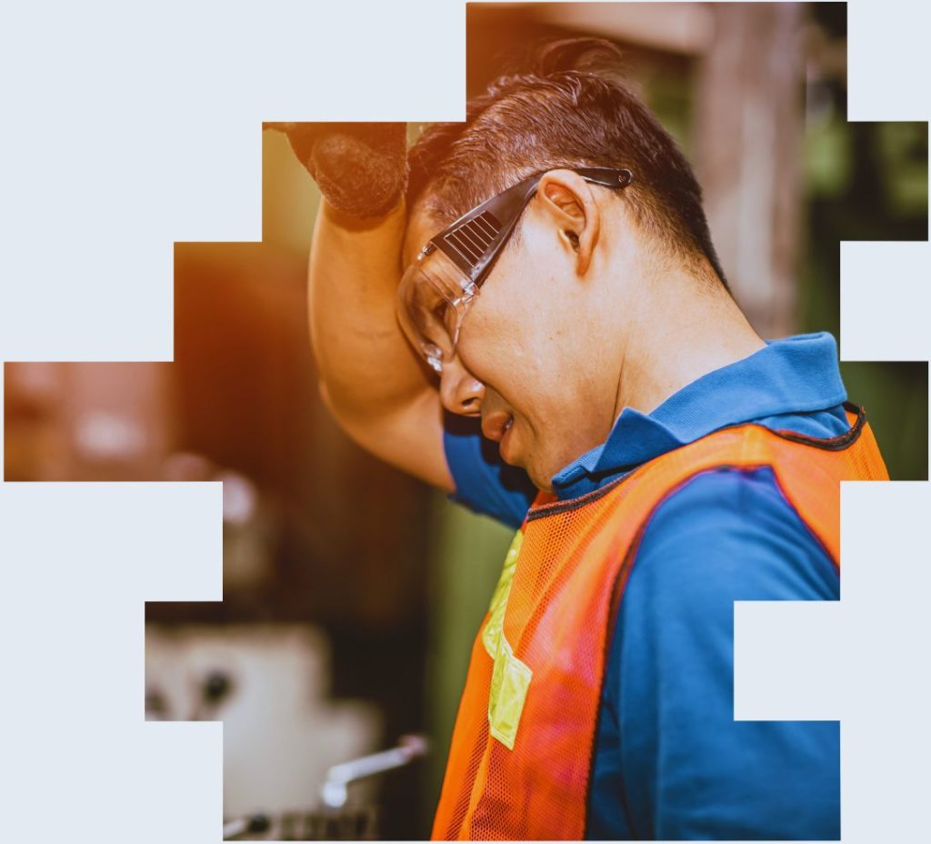 An image of a worker struggling with heat fatigue to illustrate the impact of the working environment on the health effects of night shift work