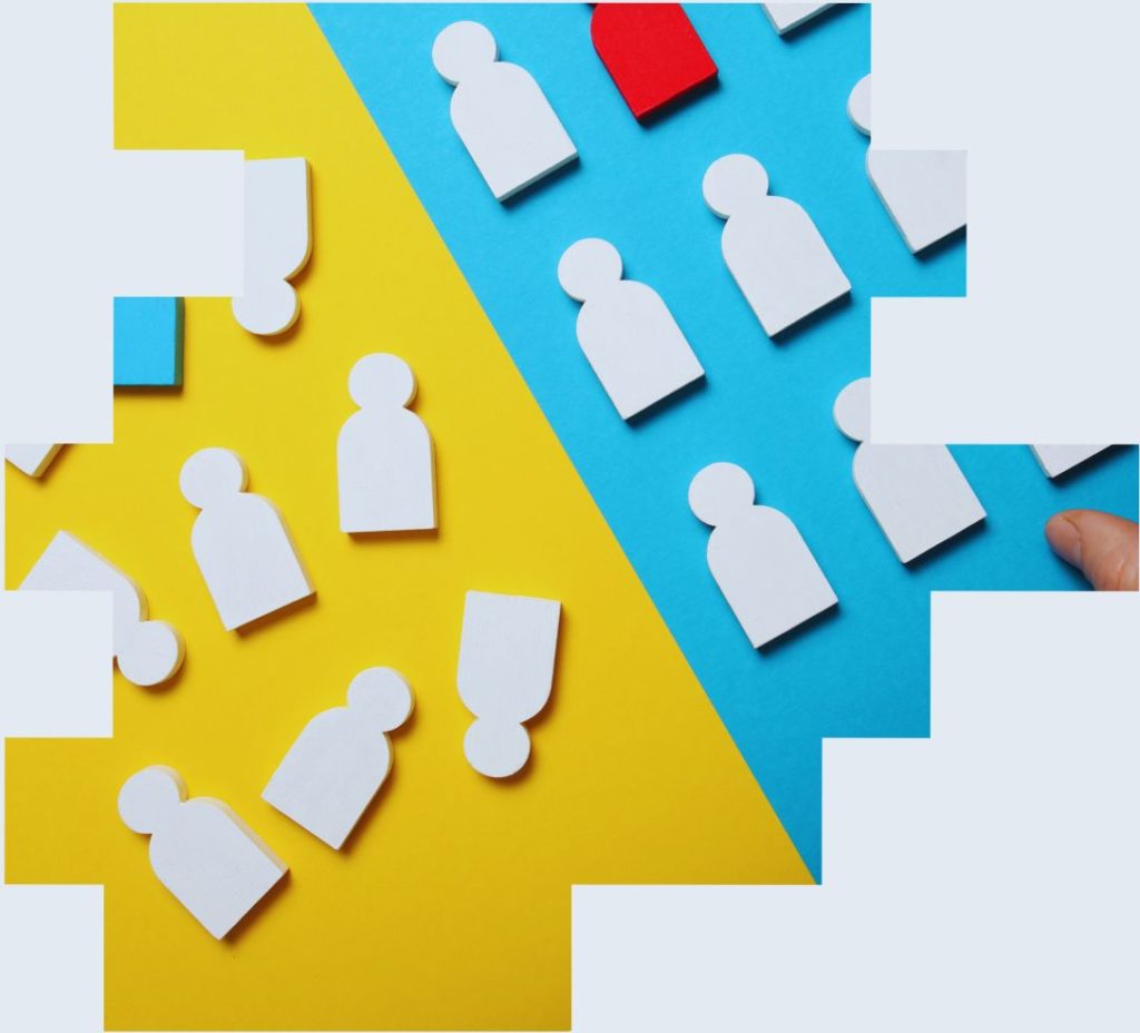 An image of a set of wooden cut outs of people being organised into straight lines to illustrate how optashift’s shift pattern generator helps increase labour productivity