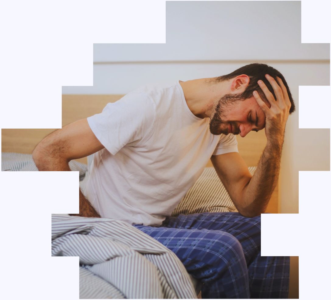An image of a shift worker on his bed in distress to illustrate how a shift work risk assessment can help you tackle health and wellbeing issues