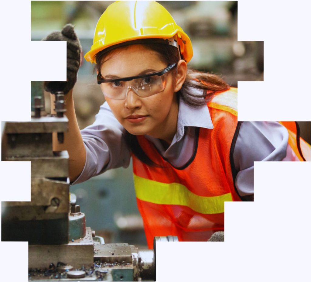 An image of a female shift worker operating some machinery to illustrate how shift work can be designed to support diversity, inclusion, recruitment and retention